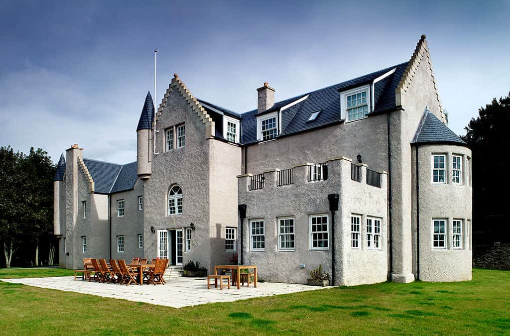 Scottish Baronial-style timber frame mansion, rear view