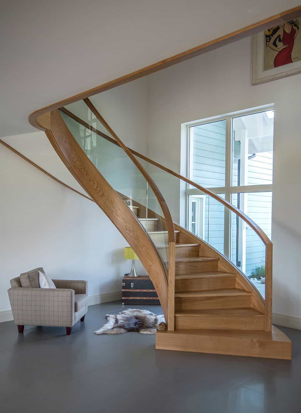 Curved staircase with timber handrail