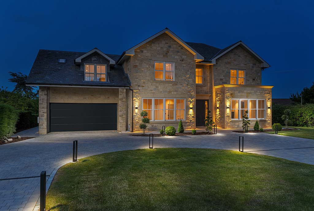 Timber frame home exterior at night