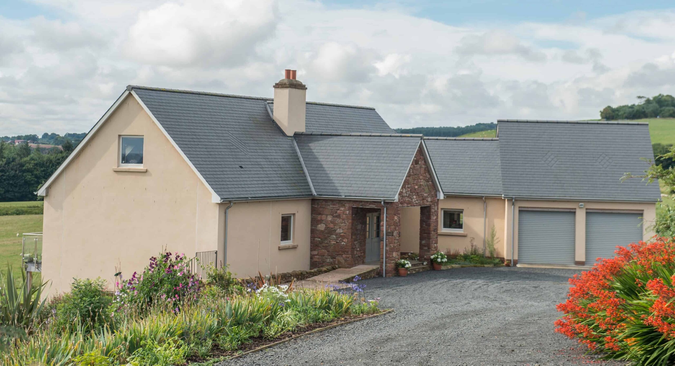 Timber frame self-build home set into a hillside