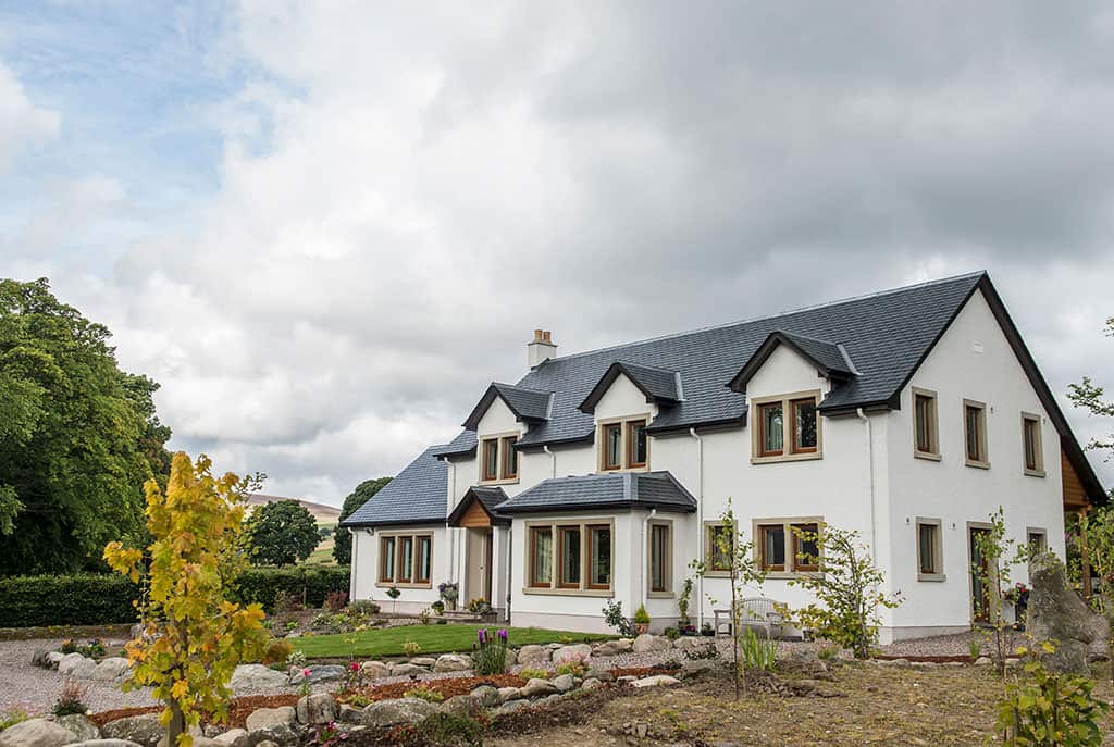 Timber frame home exterior in a rural setting