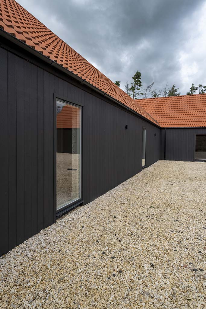 L-shaped timber clad house design exterior