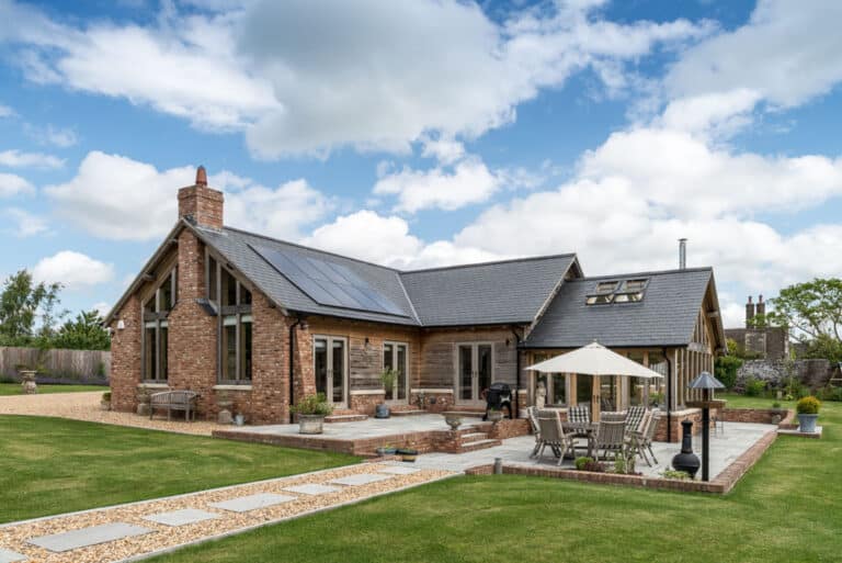Single-storey oak frame and timber frame barn-style home
