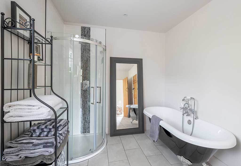 Chic en-suite bathroom interior in a timber frame self-build