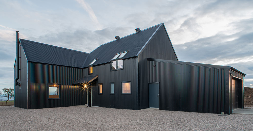 Corrugated steel cladding on a timber frame home exterior
