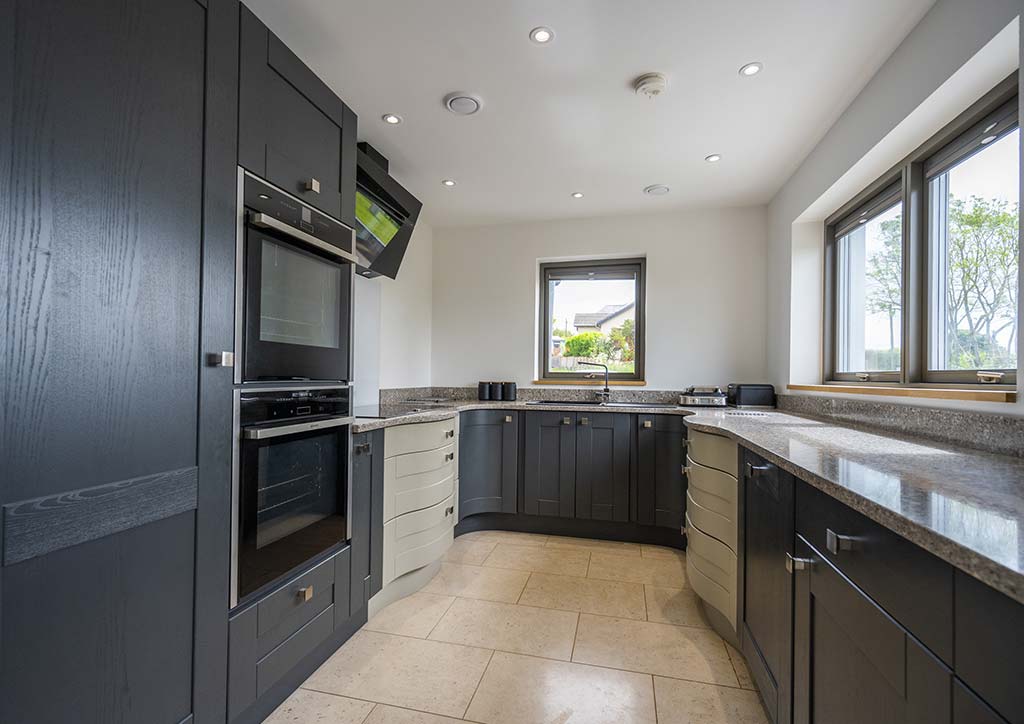 Contemporary fitted kitchen with integrated appliances