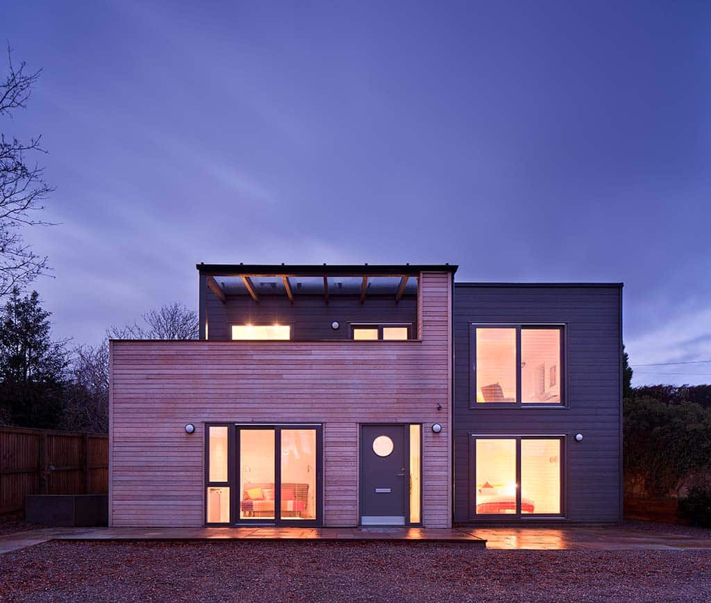 Two-storey upside-down timber frame home exterior