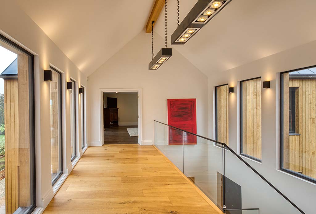 Upper floor landing interior with modern staircase view