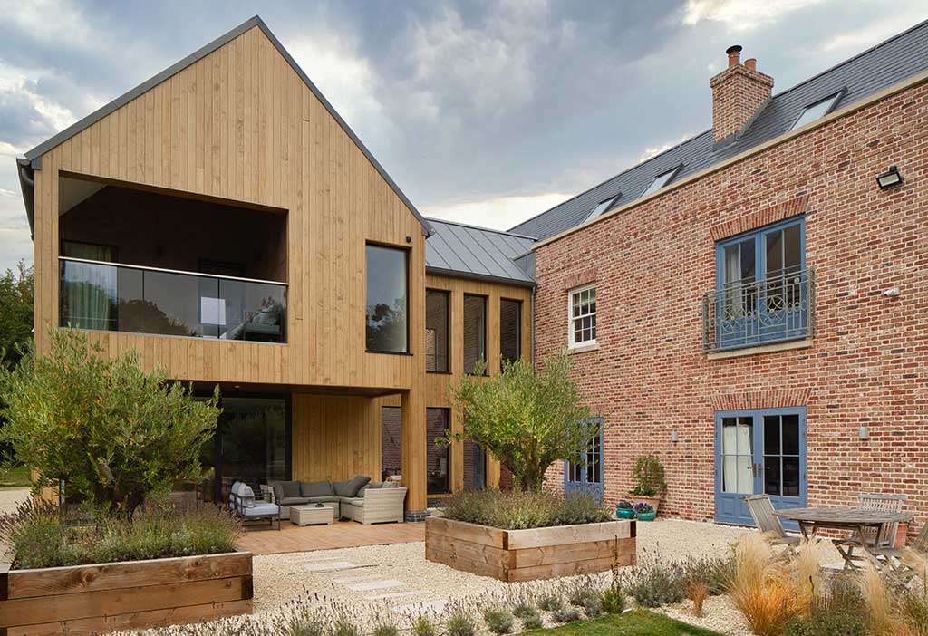 Farmhouse design timber frame with contemporary wing