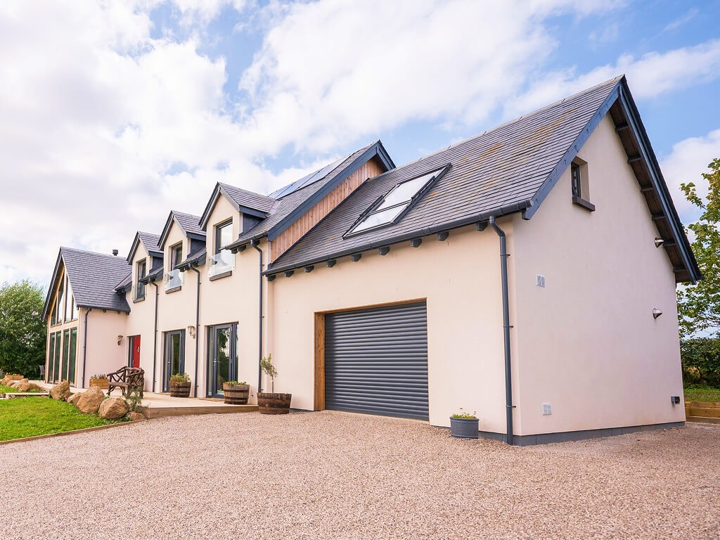 Timber frame self-build exterior in a countryside setting