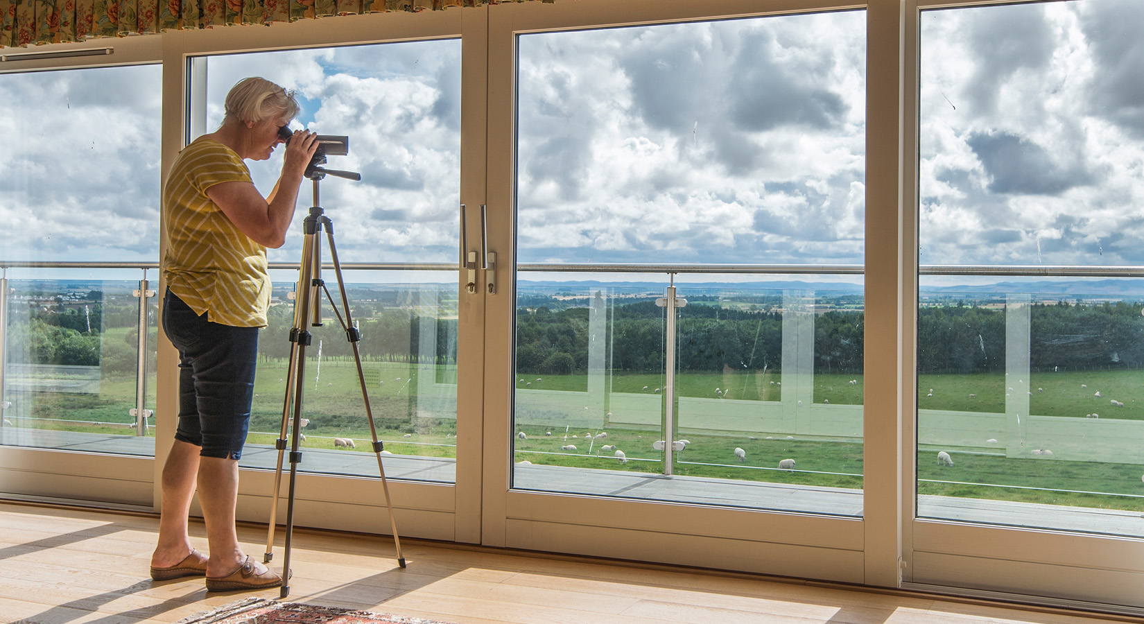 Self-builder measuring light and views during a home design project