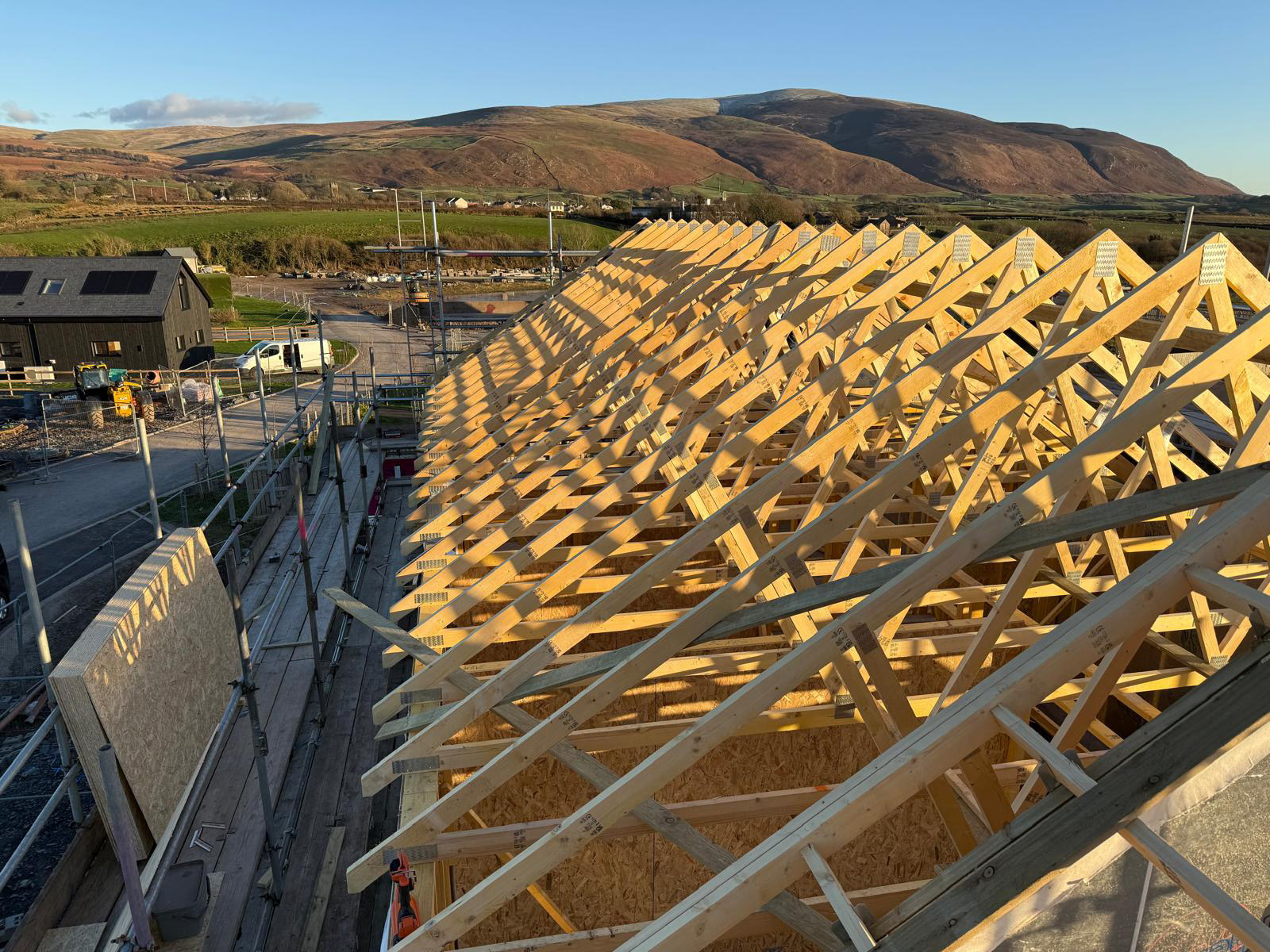 Timber frame home at wind and watertight stage, two weeks after erection begins